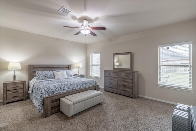 bedroom featuring ceiling fan and light carpet