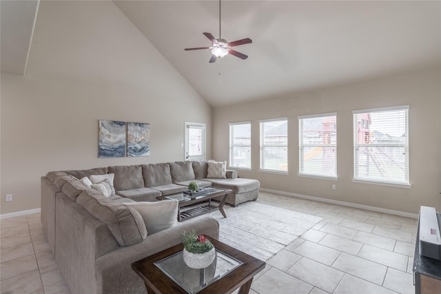 tiled living room with high vaulted ceiling and ceiling fan