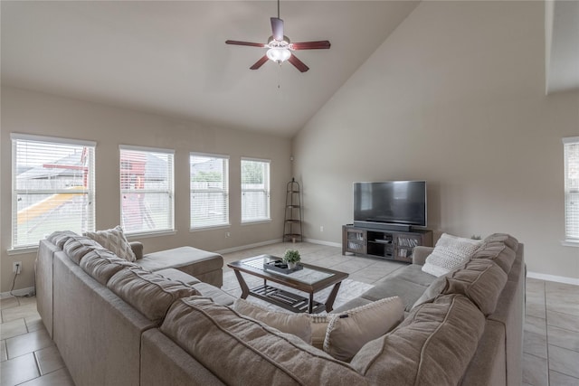 living room with light tile patterned floors, high vaulted ceiling, and ceiling fan