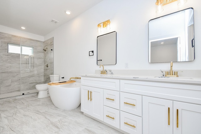 full bathroom featuring vanity, separate shower and tub, and toilet