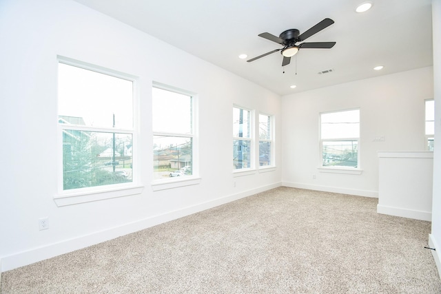 unfurnished room featuring carpet flooring and ceiling fan