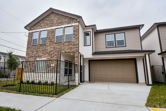 view of front of home with a garage and a front lawn