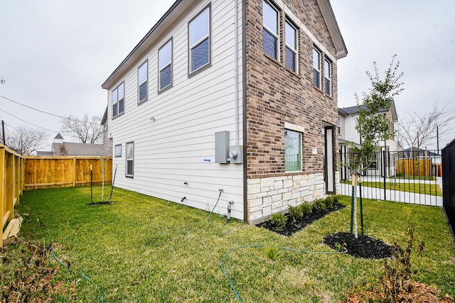 view of home's exterior featuring a yard