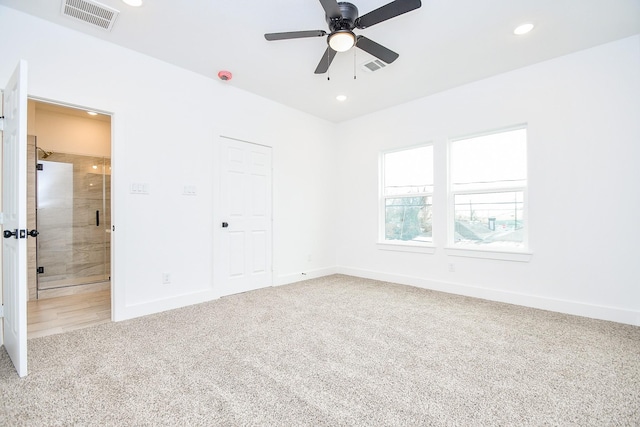 unfurnished bedroom featuring carpet floors, a closet, and ceiling fan