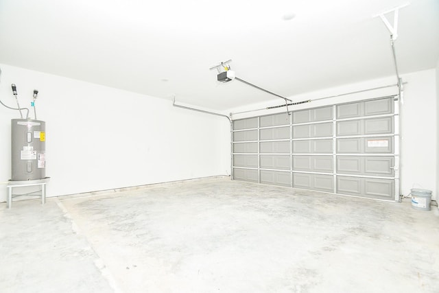 garage with a garage door opener and electric water heater