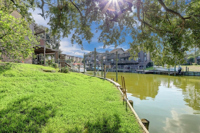 exterior space with a yard and a water view