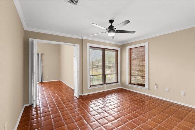 empty room with dark tile patterned floors, crown molding, and ceiling fan