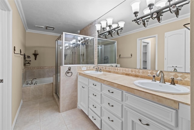 bathroom featuring an inviting chandelier, tile patterned flooring, ornamental molding, and separate shower and tub