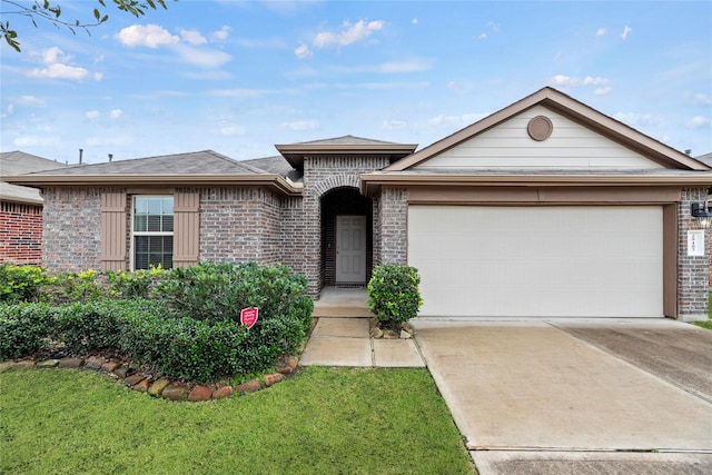 ranch-style home with a garage and a front yard