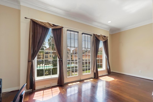 doorway to outside featuring wood-type flooring, ornamental molding, and french doors