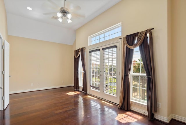 interior space featuring dark wood-type flooring, french doors, ceiling fan, and vaulted ceiling