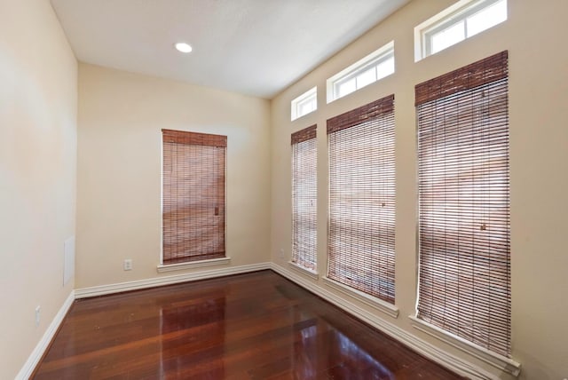 spare room featuring hardwood / wood-style floors