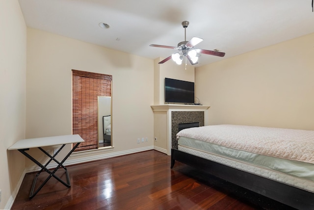 bedroom with dark wood-type flooring and ceiling fan