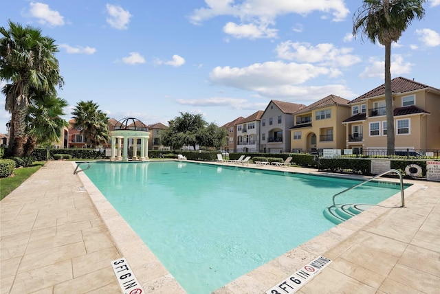 view of swimming pool featuring a patio