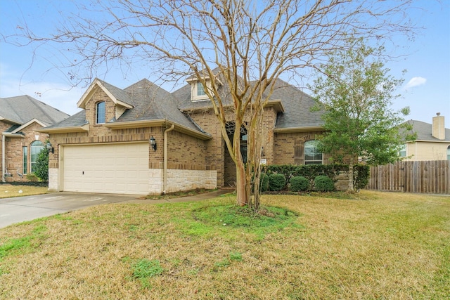 view of front facade featuring a garage and a front yard