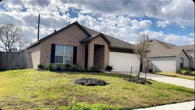 view of front of house with a garage and a front lawn