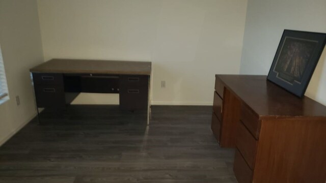 hallway with dark hardwood / wood-style floors