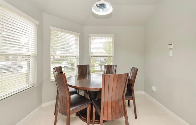 dining area with light tile patterned floors