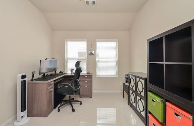 tiled office space with vaulted ceiling