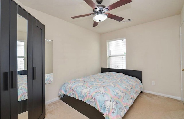 carpeted bedroom with ceiling fan