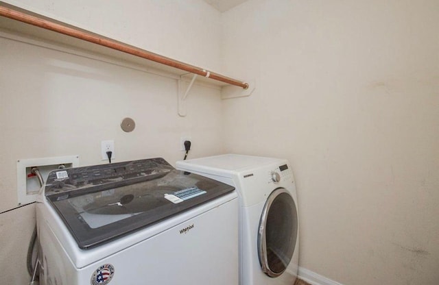 laundry room featuring separate washer and dryer