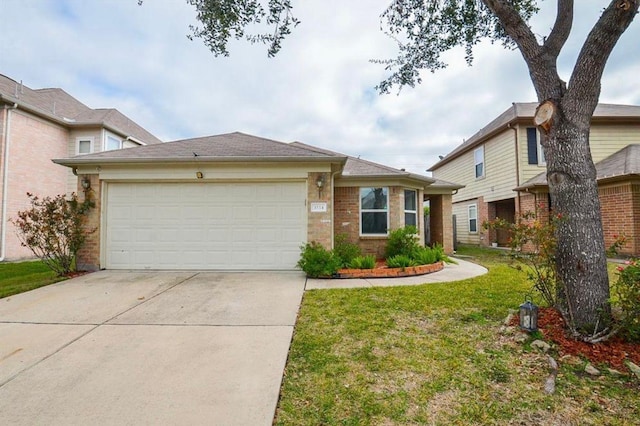 view of front of home featuring a garage and a front yard