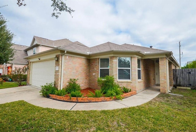 view of front of property featuring a garage and a front yard