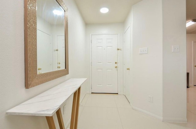 hall with light tile patterned flooring