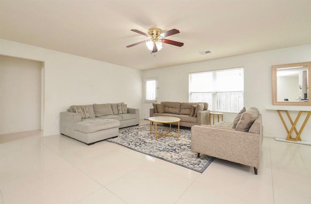 living room with tile patterned floors and ceiling fan