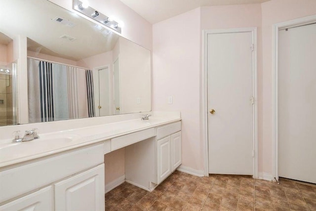 bathroom with vanity and curtained shower