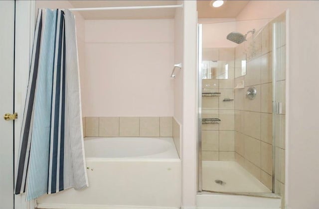 bathroom with shower with separate bathtub