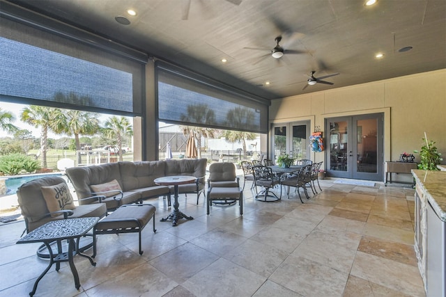 view of patio with a ceiling fan, french doors, outdoor dining area, and an outdoor living space