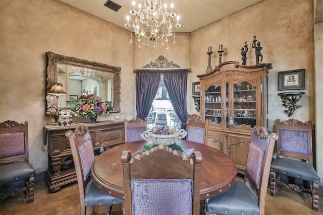 dining space with a towering ceiling, visible vents, and a notable chandelier