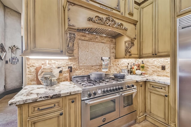 kitchen with tasteful backsplash, custom exhaust hood, high quality appliances, and light stone countertops