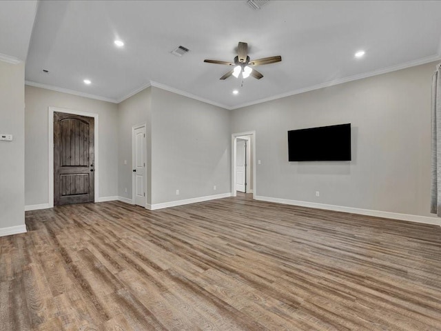 unfurnished living room featuring ceiling fan, ornamental molding, and light wood-type flooring