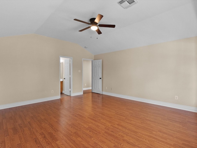 unfurnished room with vaulted ceiling, ceiling fan, and light hardwood / wood-style floors