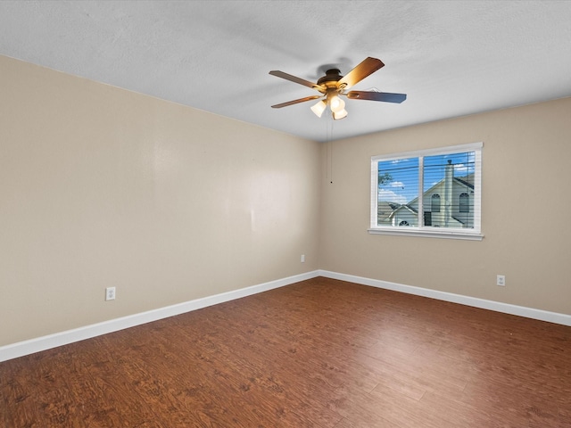 spare room featuring ceiling fan, hardwood / wood-style floors, and a textured ceiling