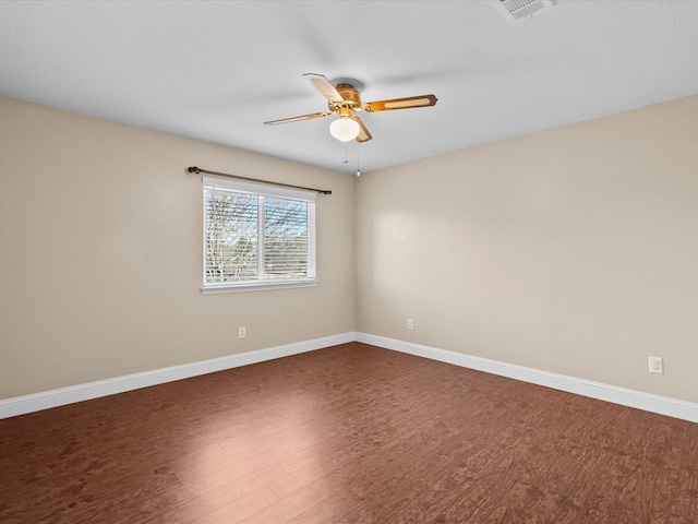 spare room featuring hardwood / wood-style flooring and ceiling fan