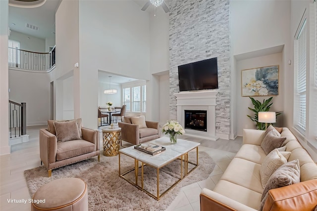 living room featuring a large fireplace