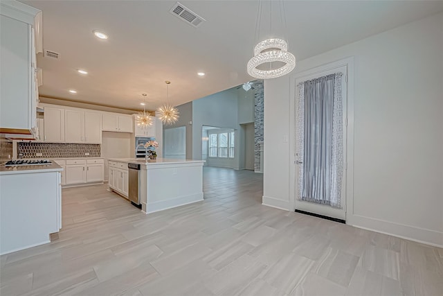 kitchen with dishwasher, white cabinets, hanging light fixtures, a kitchen island with sink, and an inviting chandelier