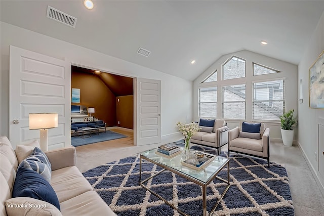 living room featuring light colored carpet and lofted ceiling