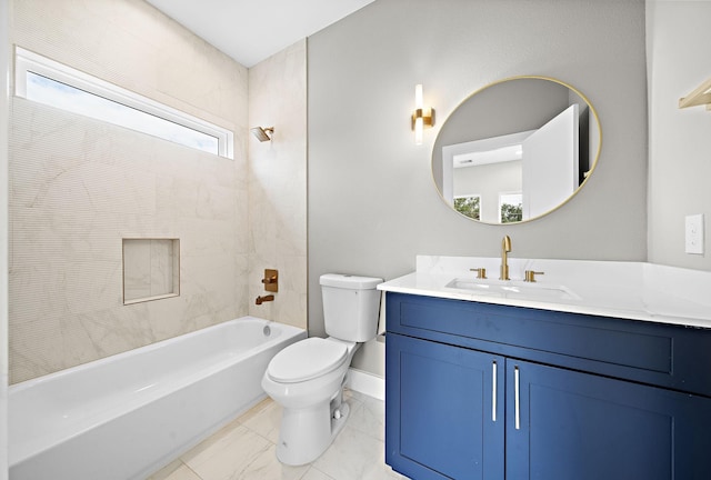 full bathroom featuring tiled shower / bath combo, vanity, and toilet