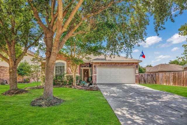 view of front of home with a garage and a front lawn