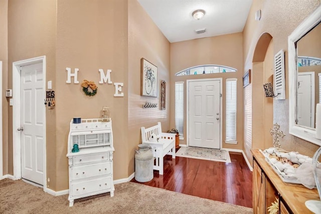 entryway with hardwood / wood-style floors