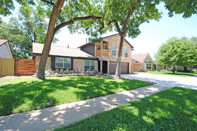 view of front of property with a garage and a front yard