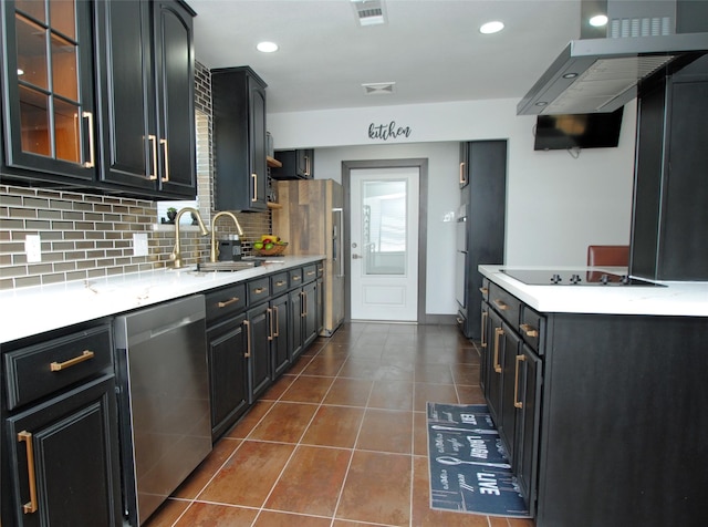 kitchen with wall chimney range hood, sink, stainless steel appliances, dark tile patterned flooring, and decorative backsplash