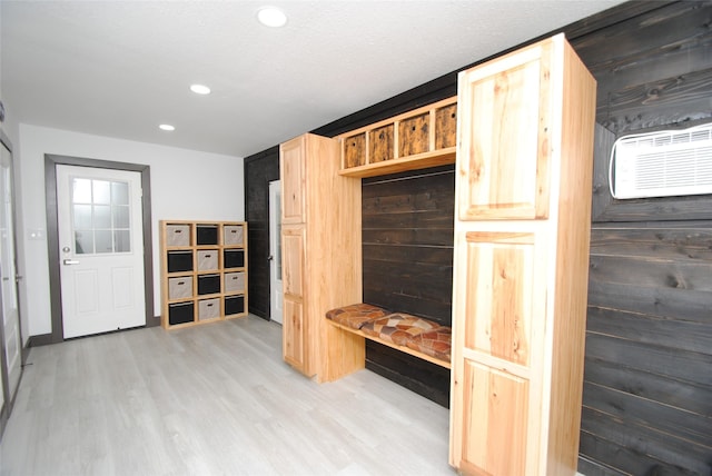 mudroom with light hardwood / wood-style floors