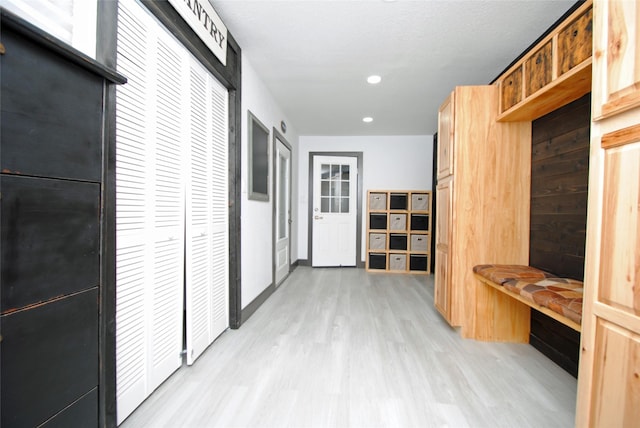 hall with light hardwood / wood-style floors