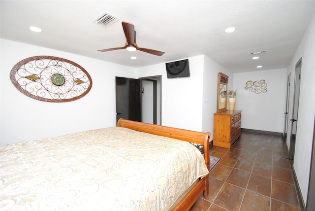 tiled bedroom featuring ceiling fan