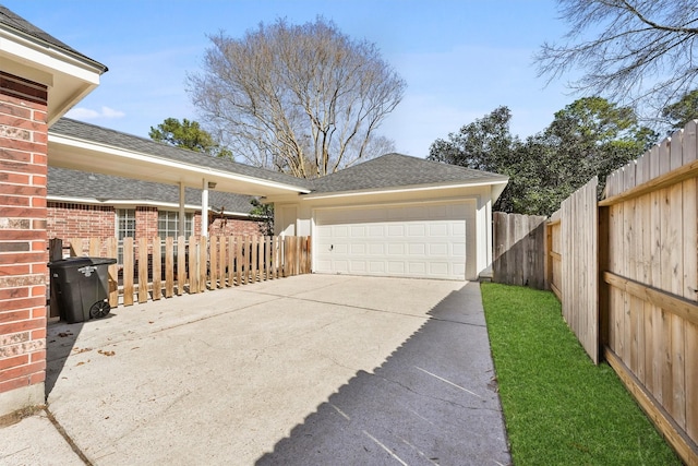 view of side of property with a garage